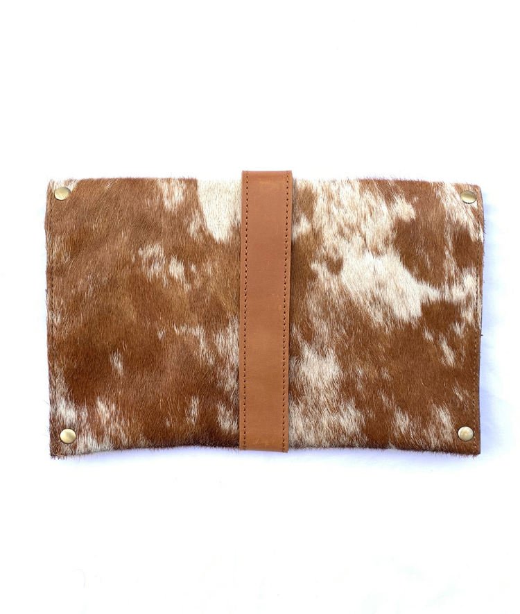 RoHo's Meaningful cowhide clutch with tan and white hide and tan finished leather accents