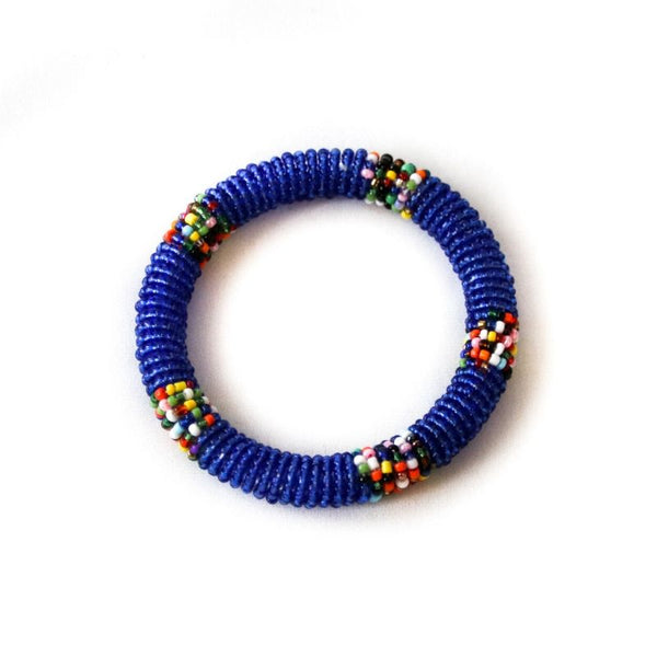 One ethical blue beaded RoHo Fair Trade small bangle against a white background