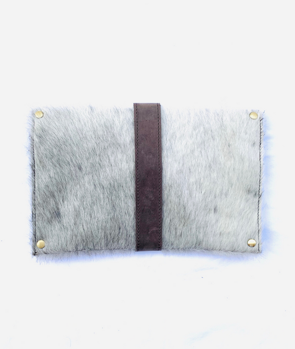 The Back of RoHo's artisan made cowhide clutch with grey hide and brown finished leather accents