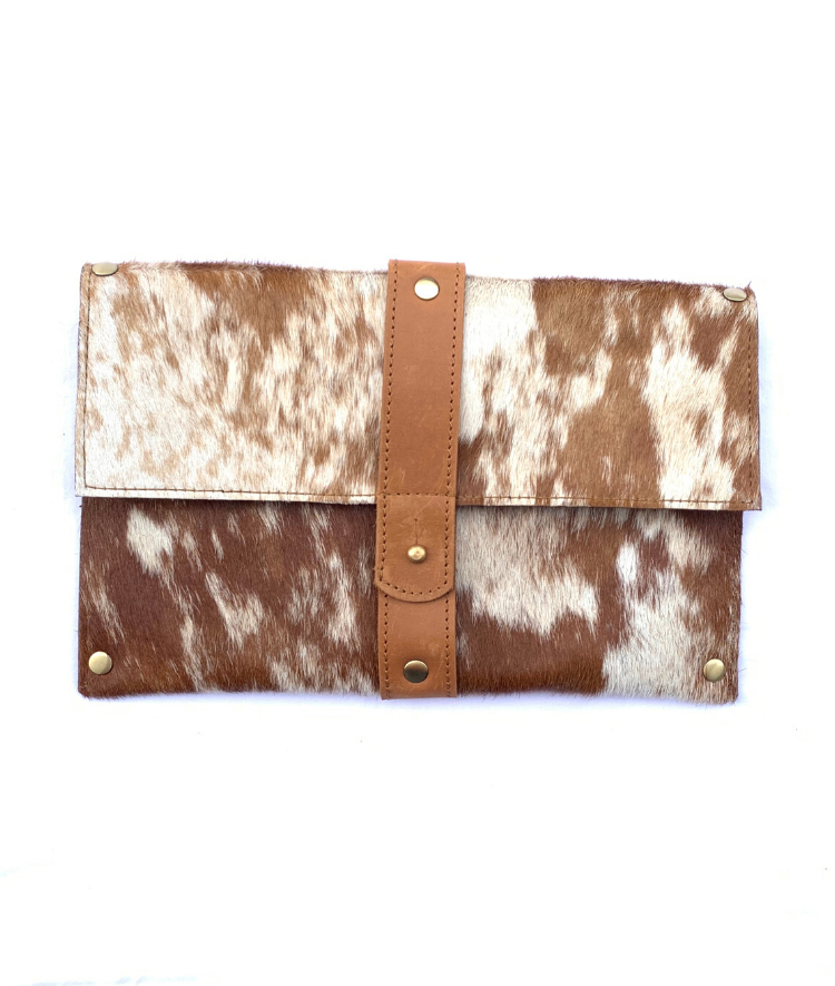 RoHo's Purposeful cowhide clutch with tan and white hide and tan finished leather accents