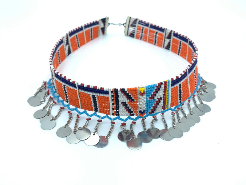 Orange beaded collar necklace with blue accents against a white background