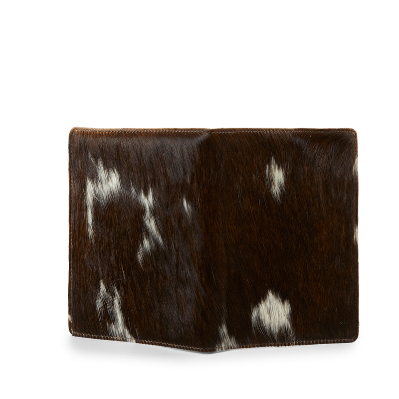 The back of RoHo's Handcrafted Beautiful Brown and White Cowhide Journals Handmade by Artisans in Kenya