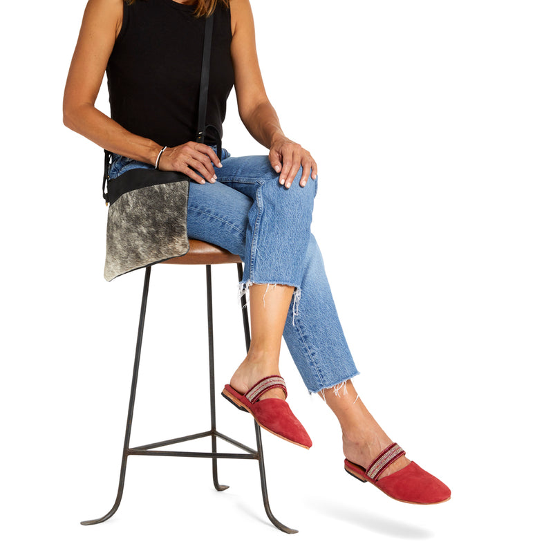 Fair Trade Handcrafted Beaded Suede Raspberry Mule, Handmade by Artisans in Kenya on a model with a white background