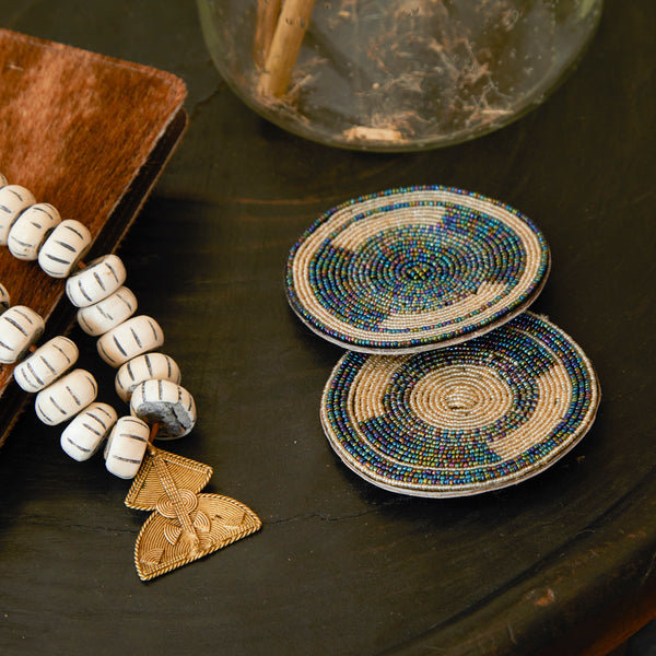 Close up of RoHo Fair Trade Handcrafted Maasai Cream & Metallic Beaded Coasters, Handmade by Artisans in Kenya