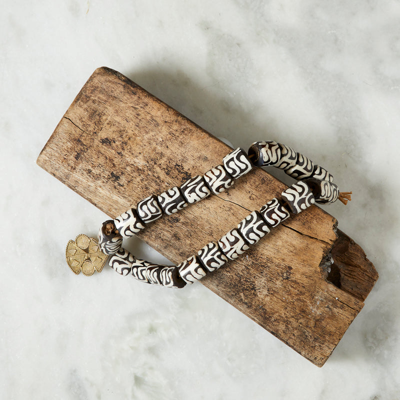 RoHo Asili Batik Fair Trade Cow Bone Beads With Pendant On a Piece of Wood