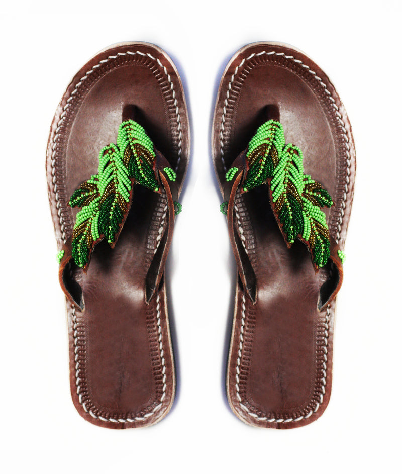 RoHo Green handmade and ethical beaded leather sandals with a beaded leaf design