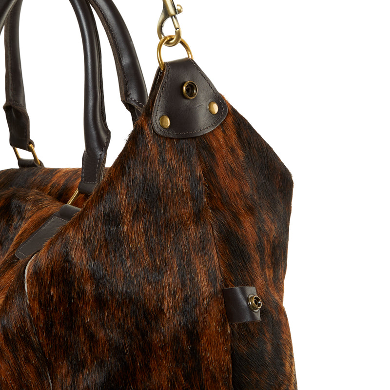 The clasp of RoHo's unique Brindle Brown Cowhide Weekender Duffel Bag with Leather Straps